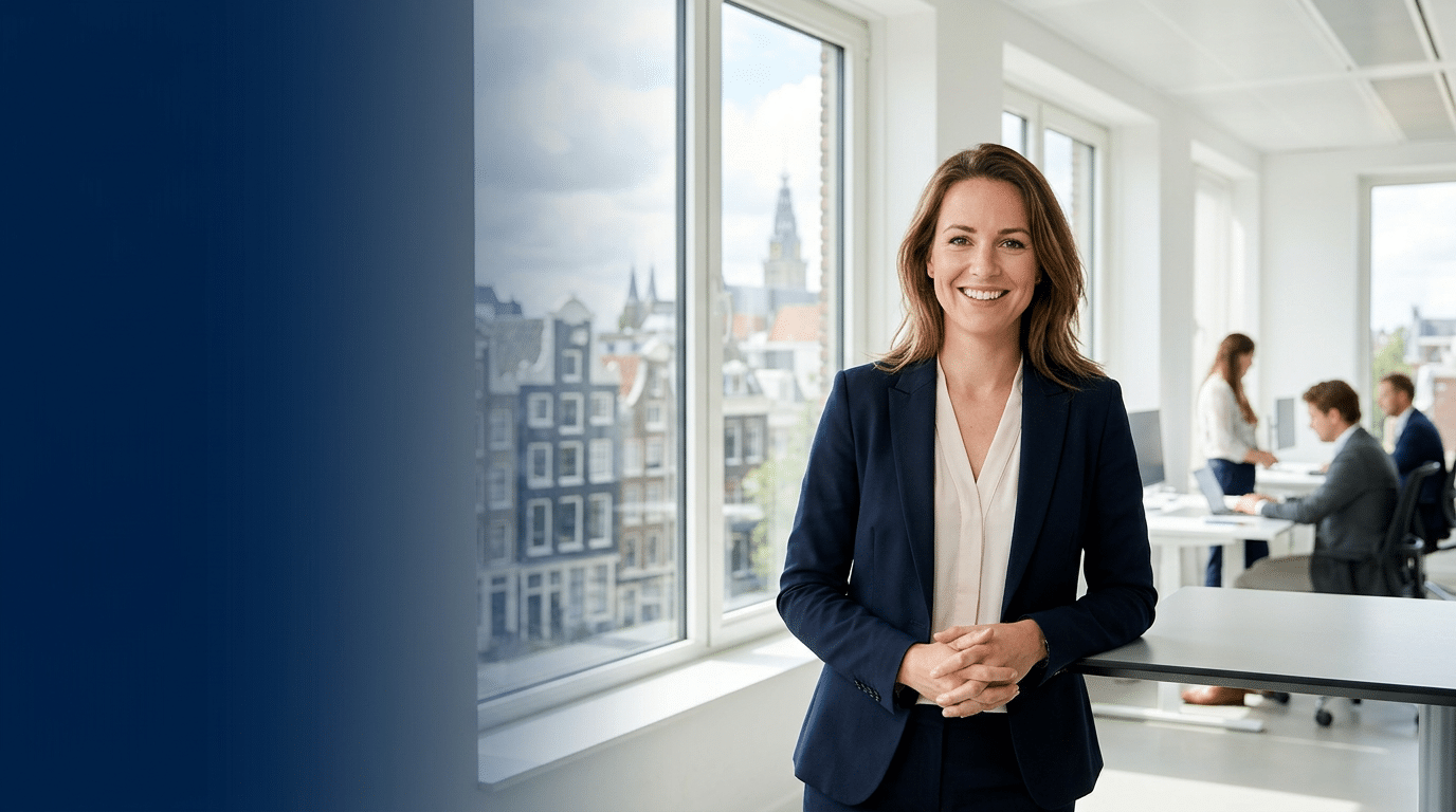 Premium hero banner. Caucasian professional woman smiling confidently looking at camera in a bright modern Dutch office, colleagues working in background, floor-to-ceiling windows with European city s (1)