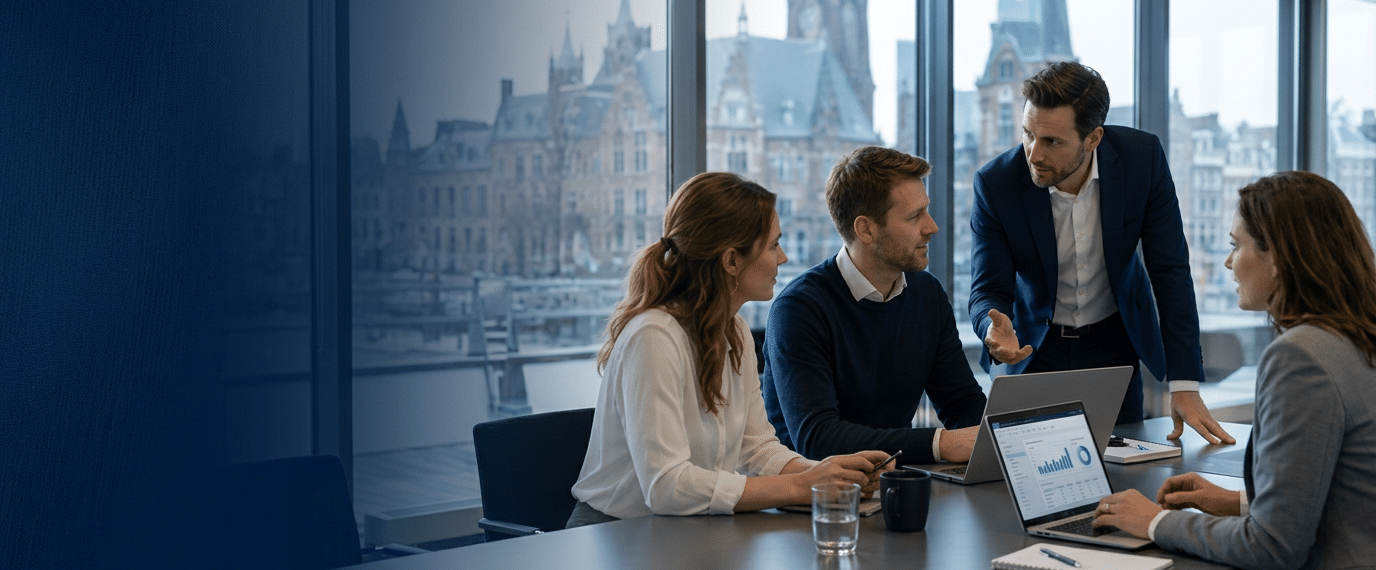 Premium hero banner. Four Caucasian professionals in business attire in a bright boardroom, engaged in a lively meeting around a large conference table, laptops open, European city skyline visible thr (1)